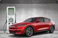 Ford electric vehicle plugged into charging station