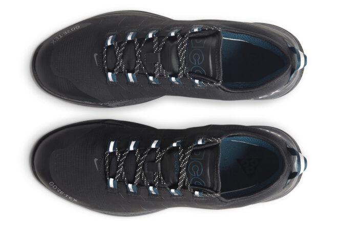 An overhead view of a pair of black and blue Nike ACG Air Nasu Gore-Tex shoes.