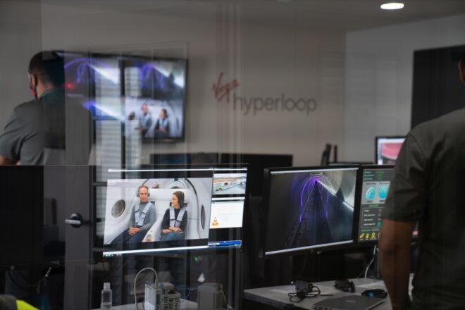 people watching computer screens to monitor Hyperloop test