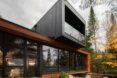 black and wood home with full-height glazing