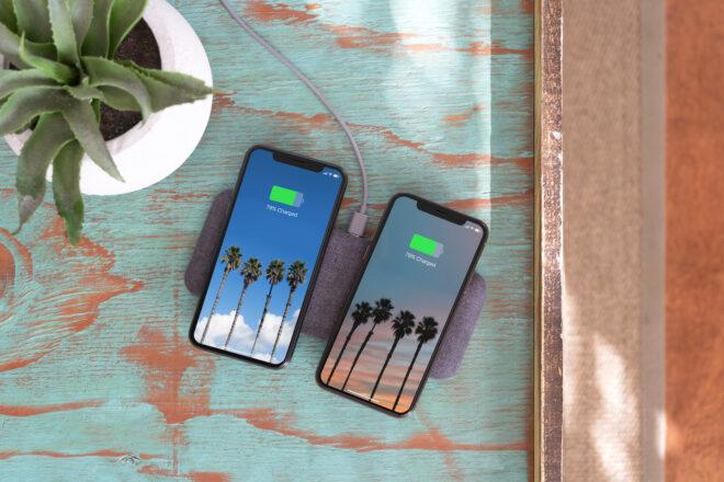 two phones charging on one wireless charger