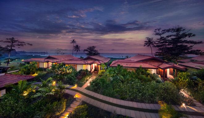 aerial view of tropical hotel resort at sunset