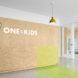 unfinished wood wall with sign that reads, 