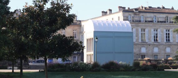 large white timber building with domed roof