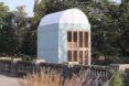 large white timber building with domed roof