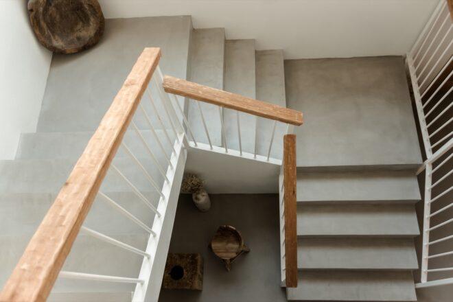 gray stairs with wood railings