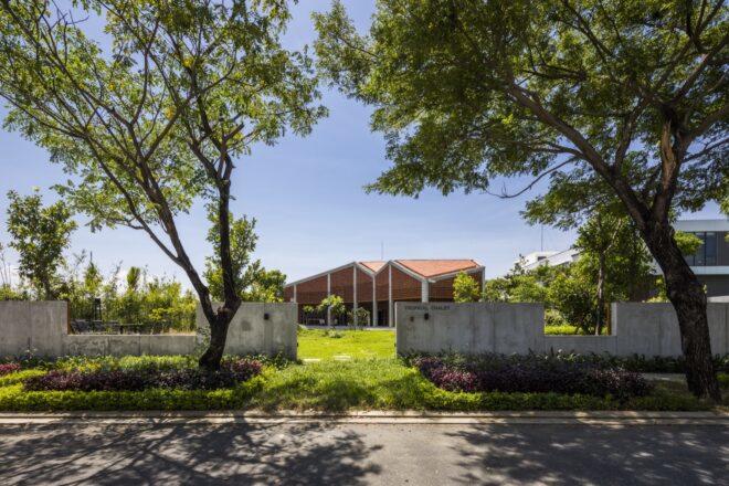 perforated brick home with geometric roof