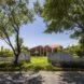perforated brick home with geometric roof