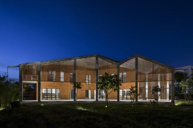 perforated brick home with zig-zag roof