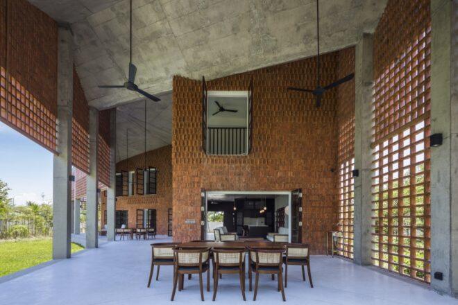 large dining table near brick wall