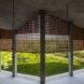 covered patio with partial brick walls