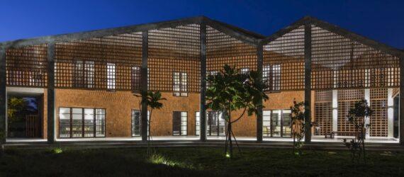 perforated brick home with zig-zag roof