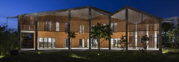 perforated brick home with zig-zag roof