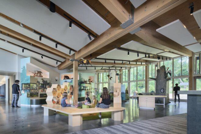 people looking a exhibits inside a nature center building