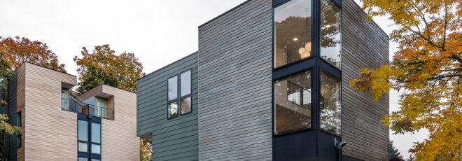 From left to right: the secondary townhome, the main townhome and a yellow tree beside it.