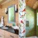 Bathroom with green shower tiles and wood cabinets