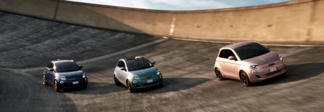 rose gold, gray and black Fiats racing on a track
