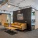 tan sofa near enclosed cubic meeting room