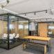 wood table near enclosed glass meeting room