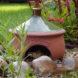 frog habitat container in garden