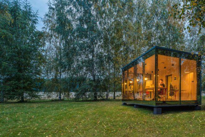 glass cabin in the woods