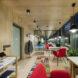 wood desks and red chairs in wood cabin