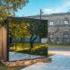 glass cabin with mirrored facade in a city