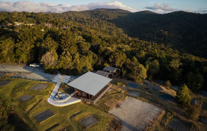 aerial view of campsite amenity buildings in a forest