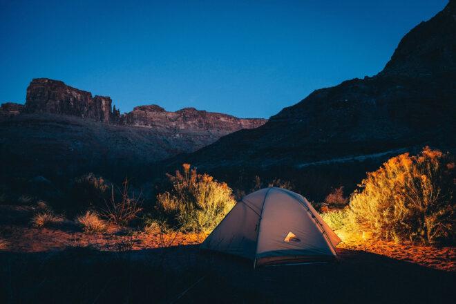 A tent in the middle of a desert.