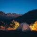 A tent in the middle of a desert.