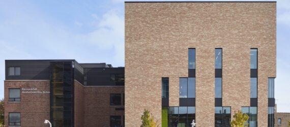 brick school building with narrow windows