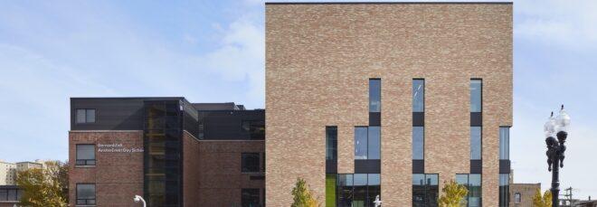 brick school building with narrow windows