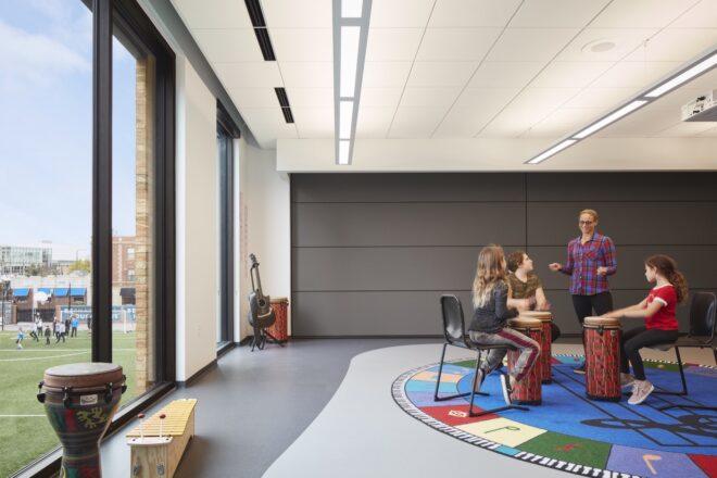 play room with large windows and a retractable gray wall