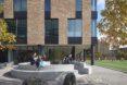 kids sitting on concrete seats in outdoor space