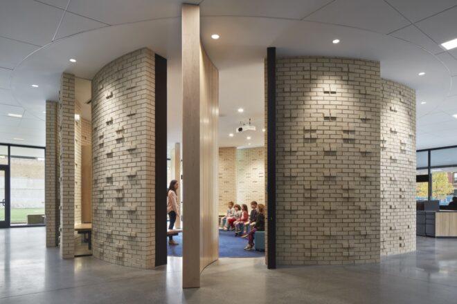 curving wall opening to a classroom