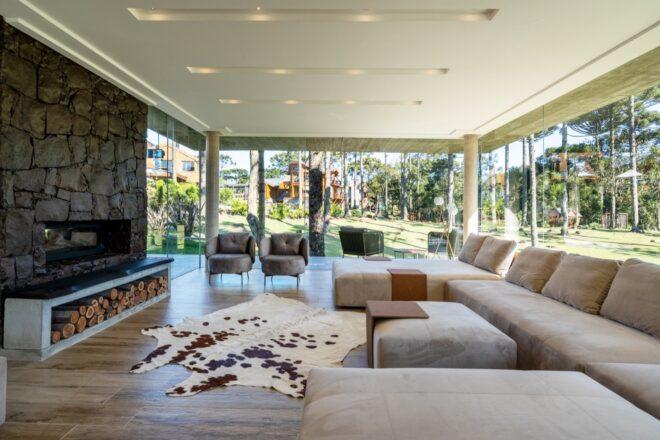 large beige sectional sofa facing a fireplace