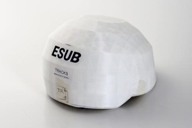 A white helmet with the text "ESUB" written on it.