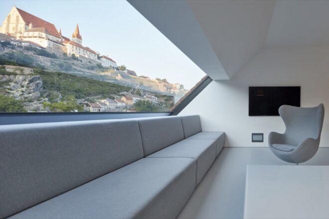 white sofa against a glass wall