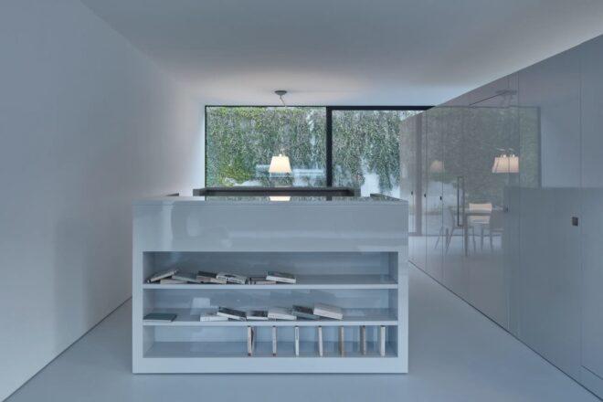 white kitchen island with shelves on the end