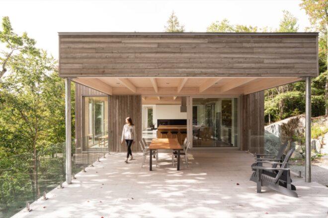 covered patio attached to a wood home