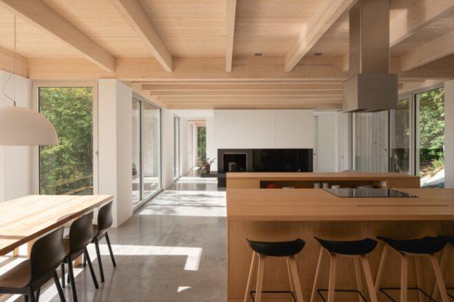 wood kitchen island near wood dining table