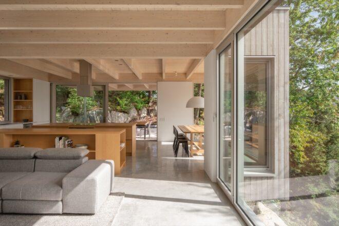 white sofa near large sliding glass wall