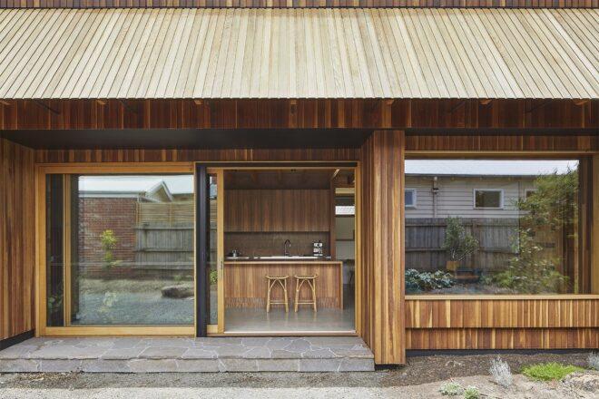 wood home with sliding glass door opening to a patio