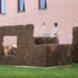 large structure made from plant scraps