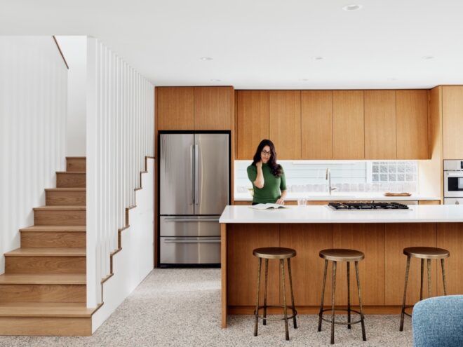 white kitchen island near kitchen with wood cabinets