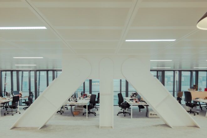 long white desks in white office room