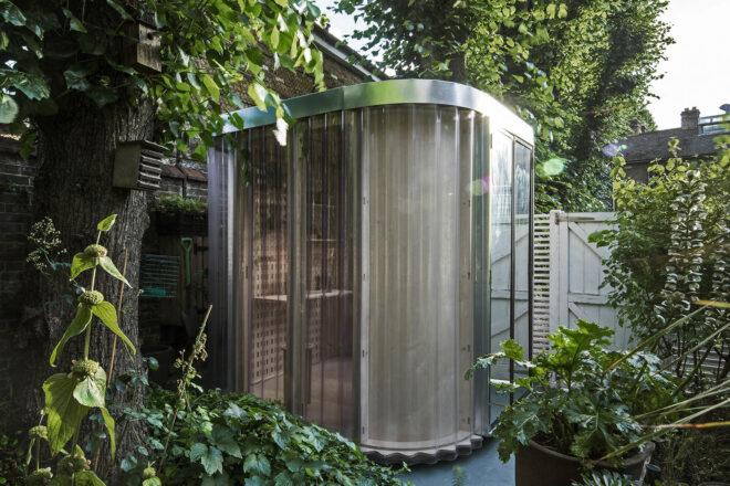 A modular pod room in a garden.