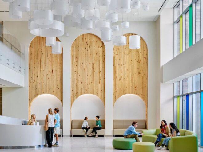lounge area with white walls and wood accents
