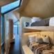 A bedroom with light-colored wood accents.