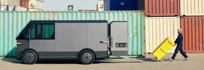 person loading yellow containers on gray van